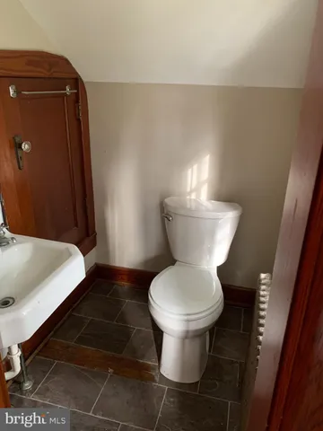a bathroom with a toilet and a sink