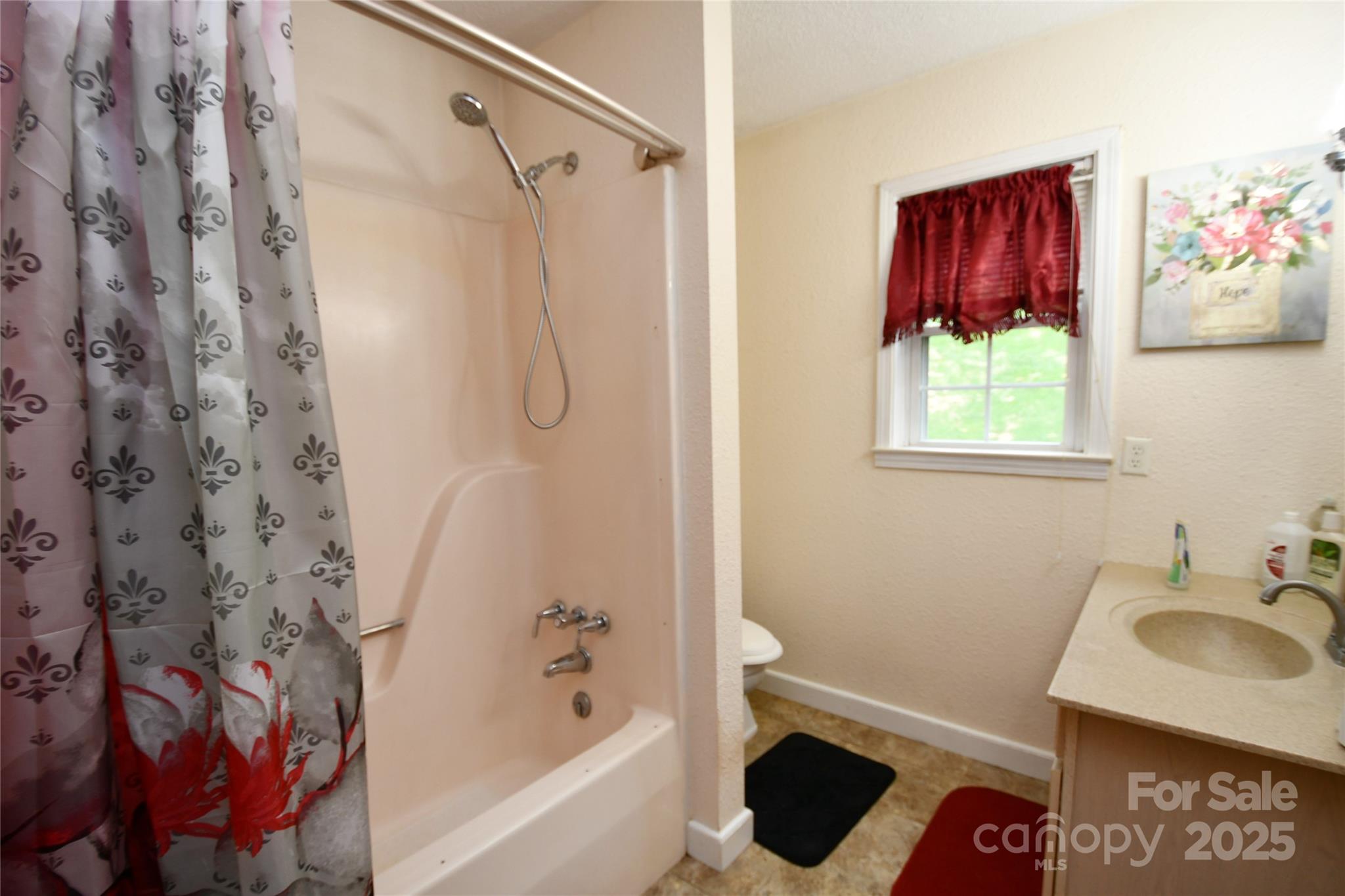 1227 Georges Fork Road Burnsville, NC 28714 - Photo 15 of 36 a bathroom with a sink toilet and shower