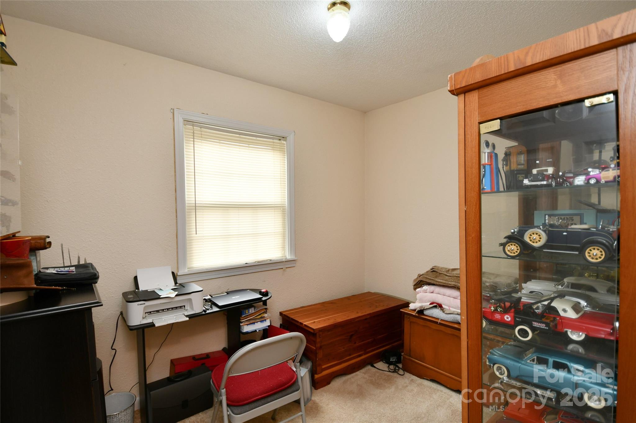 1227 Georges Fork Road Burnsville, NC 28714 - Photo 20 of 36 a room with furniture and window