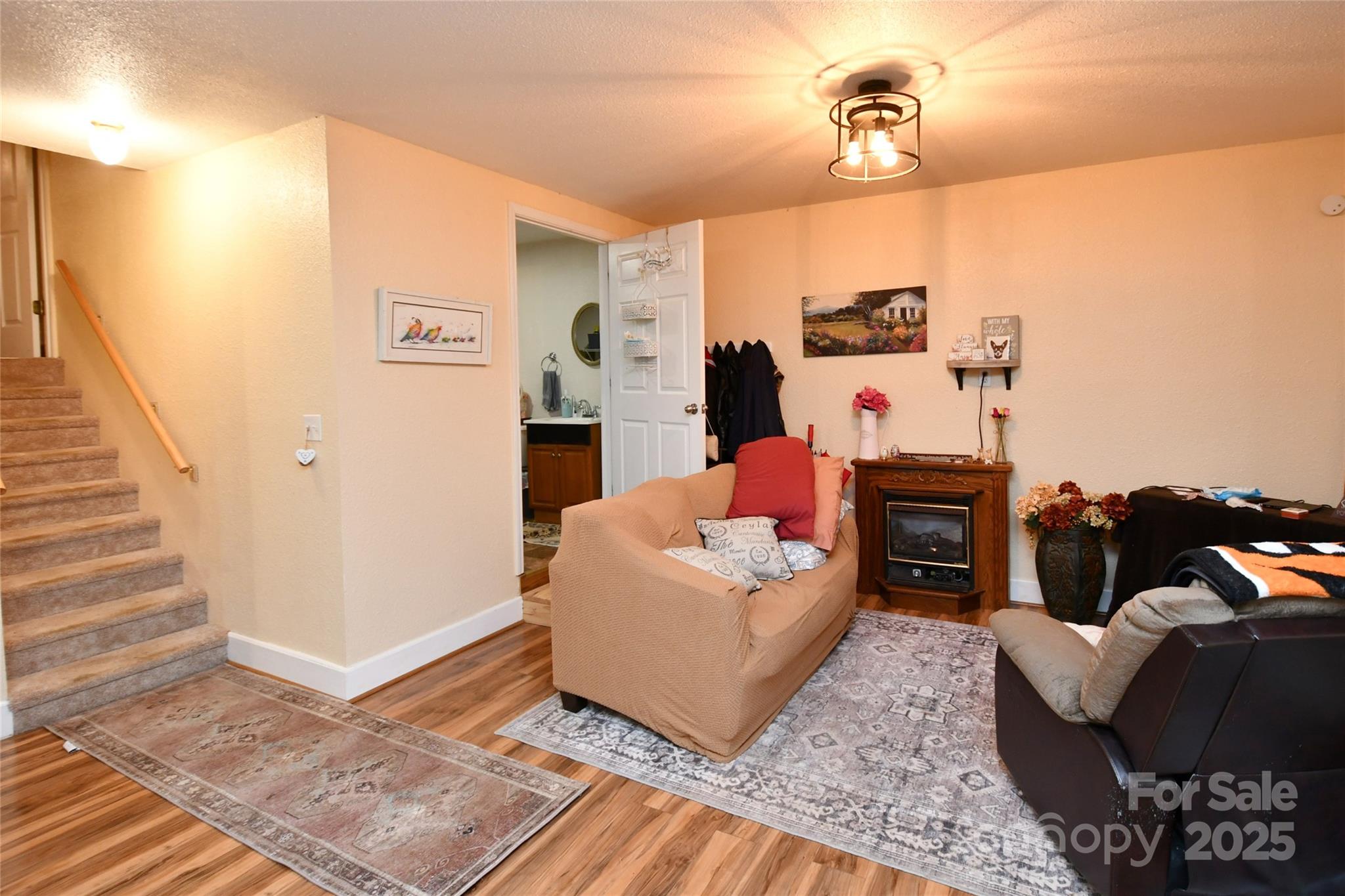 1227 Georges Fork Road Burnsville, NC 28714 - Photo 25 of 36 a living room with furniture and a rug