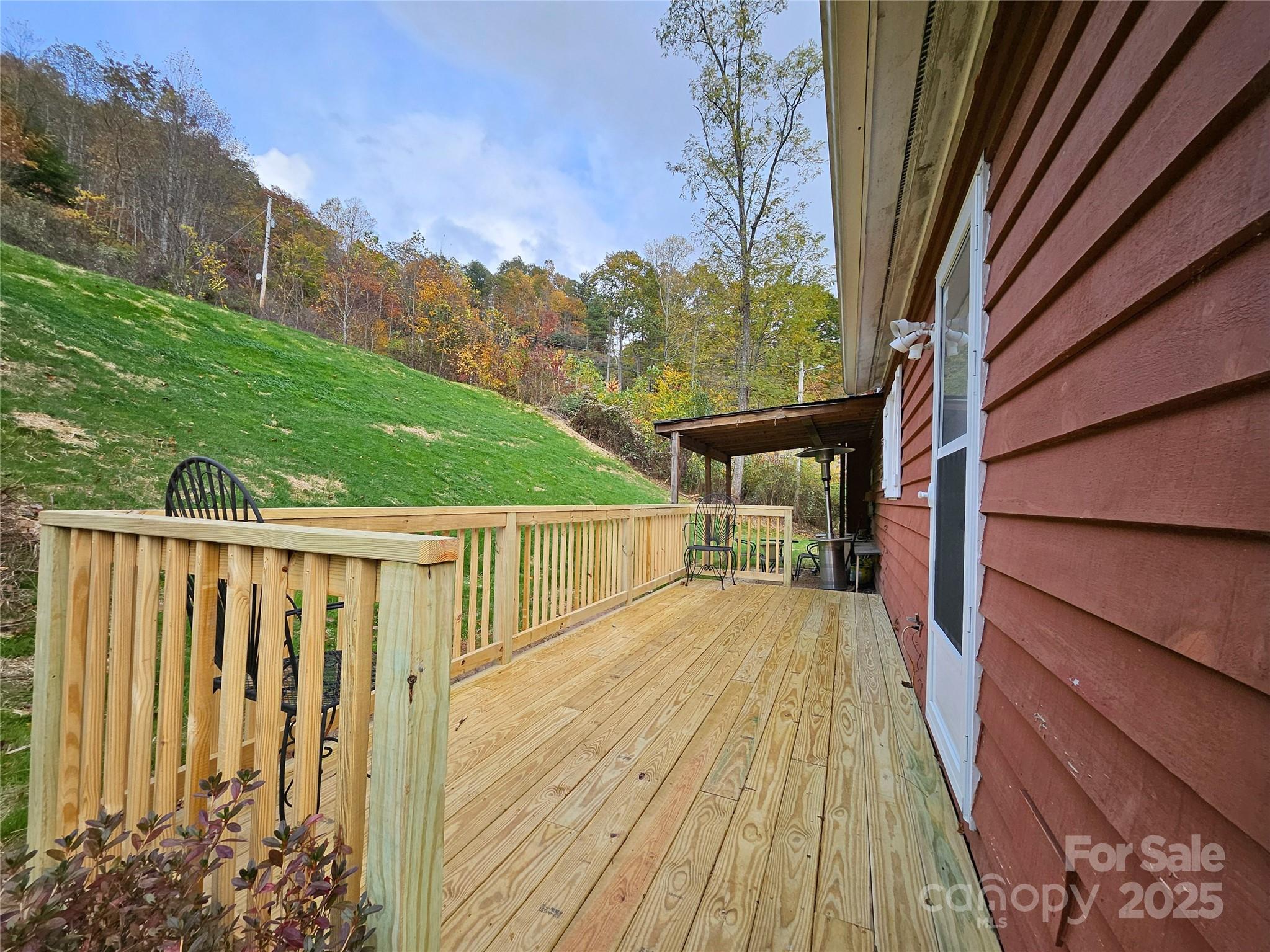 1227 Georges Fork Road Burnsville, NC 28714 - Photo 32 of 36 a view of balcony with wooden floor and fence