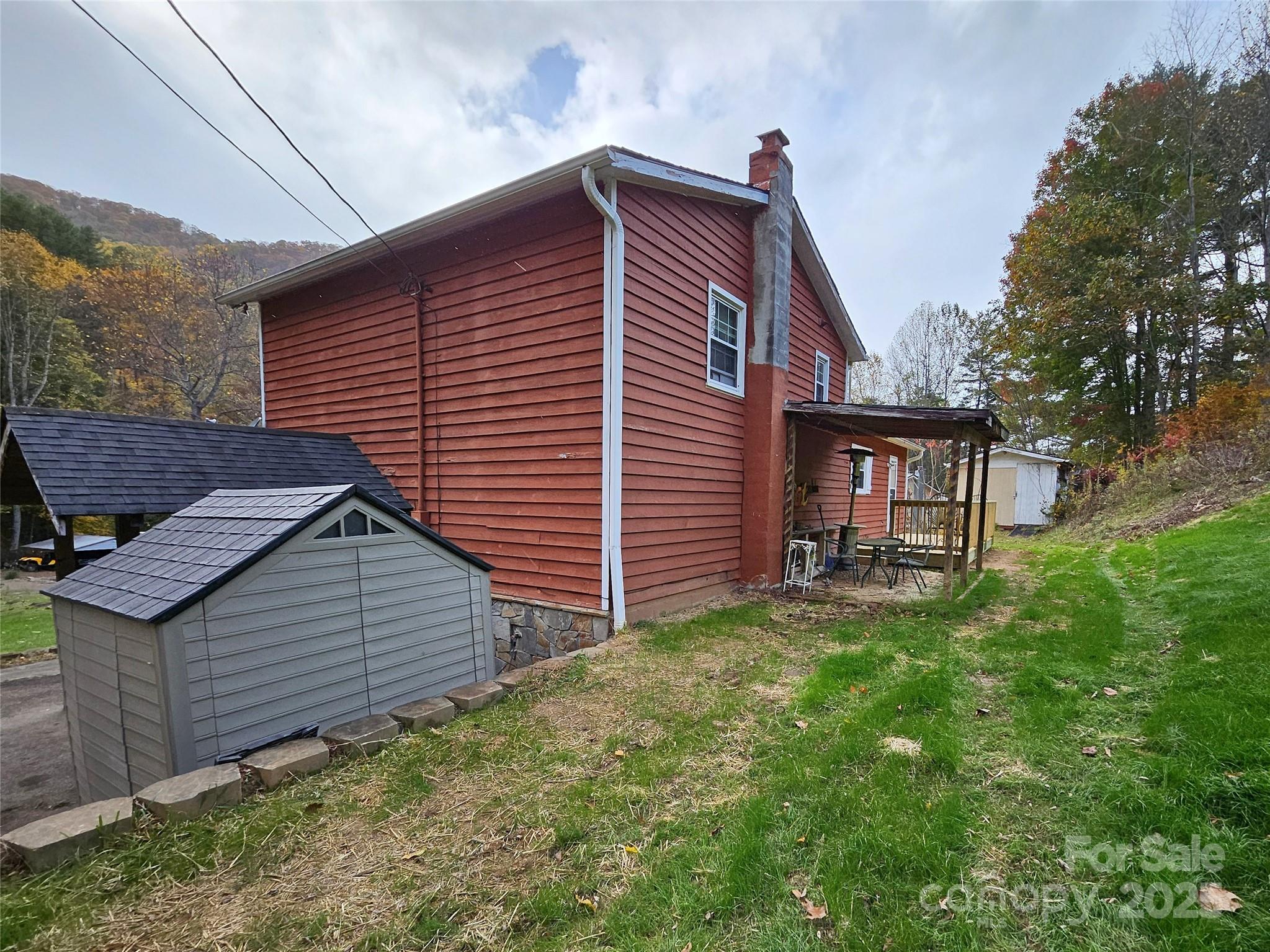 1227 Georges Fork Road Burnsville, NC 28714 - Photo 33 of 36 a view of a house with a yard