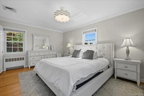 a spacious bedroom with a bed and a window