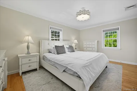 a bedroom with bed and window