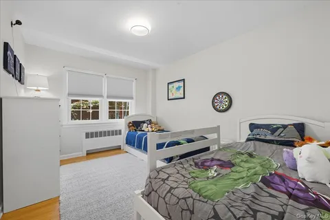 a bedroom with bed and a window