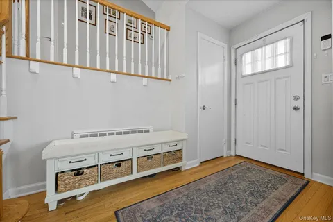 a room with a bed and a dresser