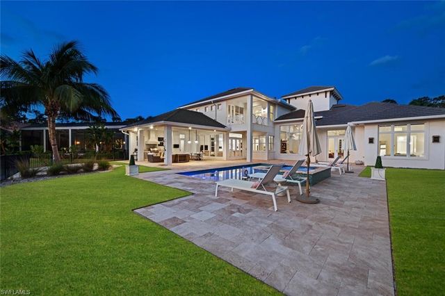 a view of a house with a yard porch and sitting area