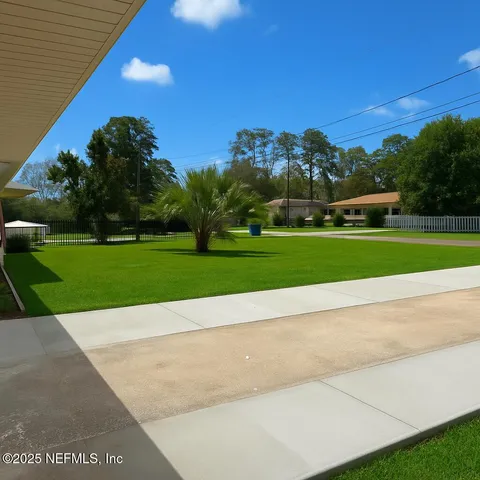 a view of a golf course with a street