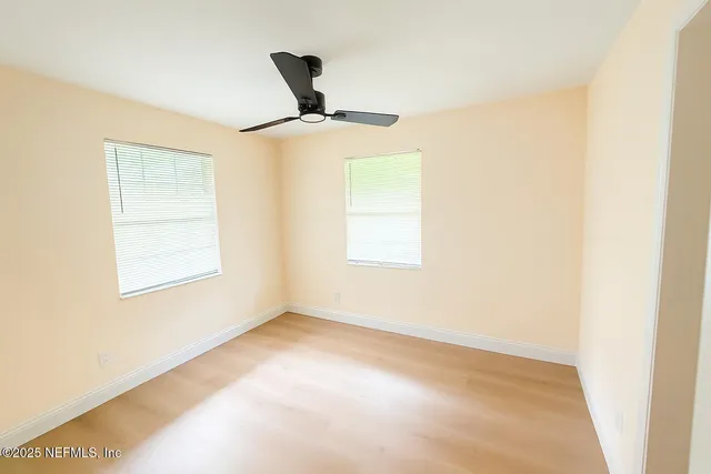 a view of an empty room with a window