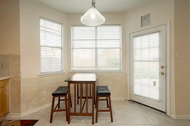 a kitchen that has a cabinets and a table in it