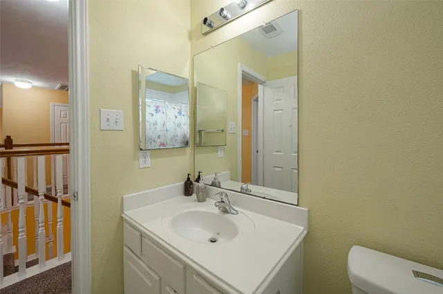 a bedroom with a bed and a book shelf