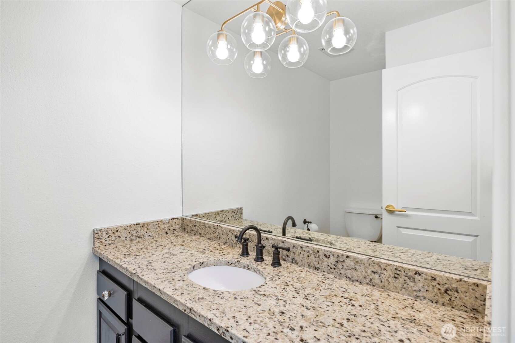 121 West Winesap Road Bothell, WA 98012 - Photo 23 of 29 a bathroom with a sink and a mirror