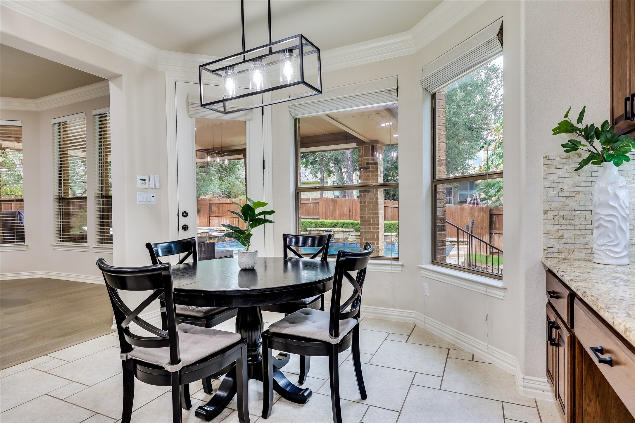 408 Ridgetop Bend Cedar Park, TX 78613 - Photo 17 of 40 A well-lit breakfast nook offers ample seating and views of the inviting outdoor pool.