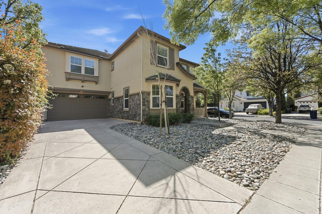 698 West Rico Way Tracy, CA 95391 - Photo 2 of 48 a front view of a house with garden