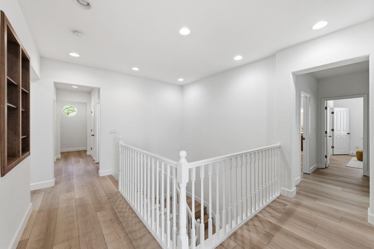 698 West Rico Way Tracy, CA 95391 - Photo 24 of 48 a view of a hallway with wooden floor
