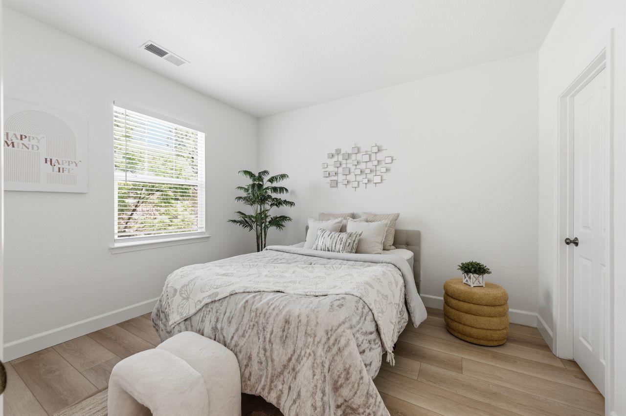 698 West Rico Way Tracy, CA 95391 - Photo 41 of 48 a bedroom with a bed and chair