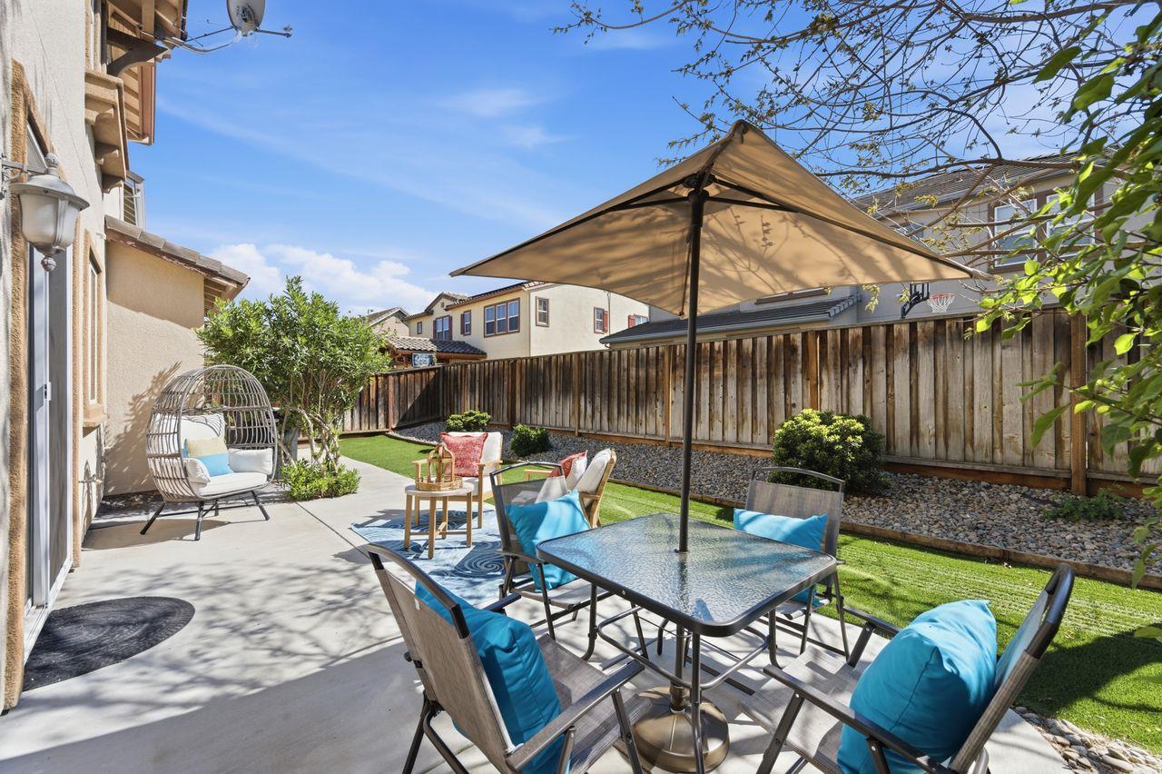 698 West Rico Way Tracy, CA 95391 - Photo 44 of 48 a view of backyard with seating space and wooden fence