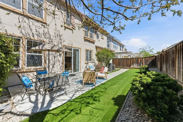 a view of yard with patio