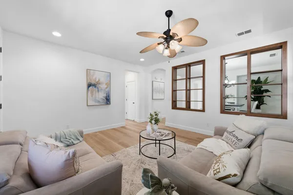 a living room with furniture and a large window