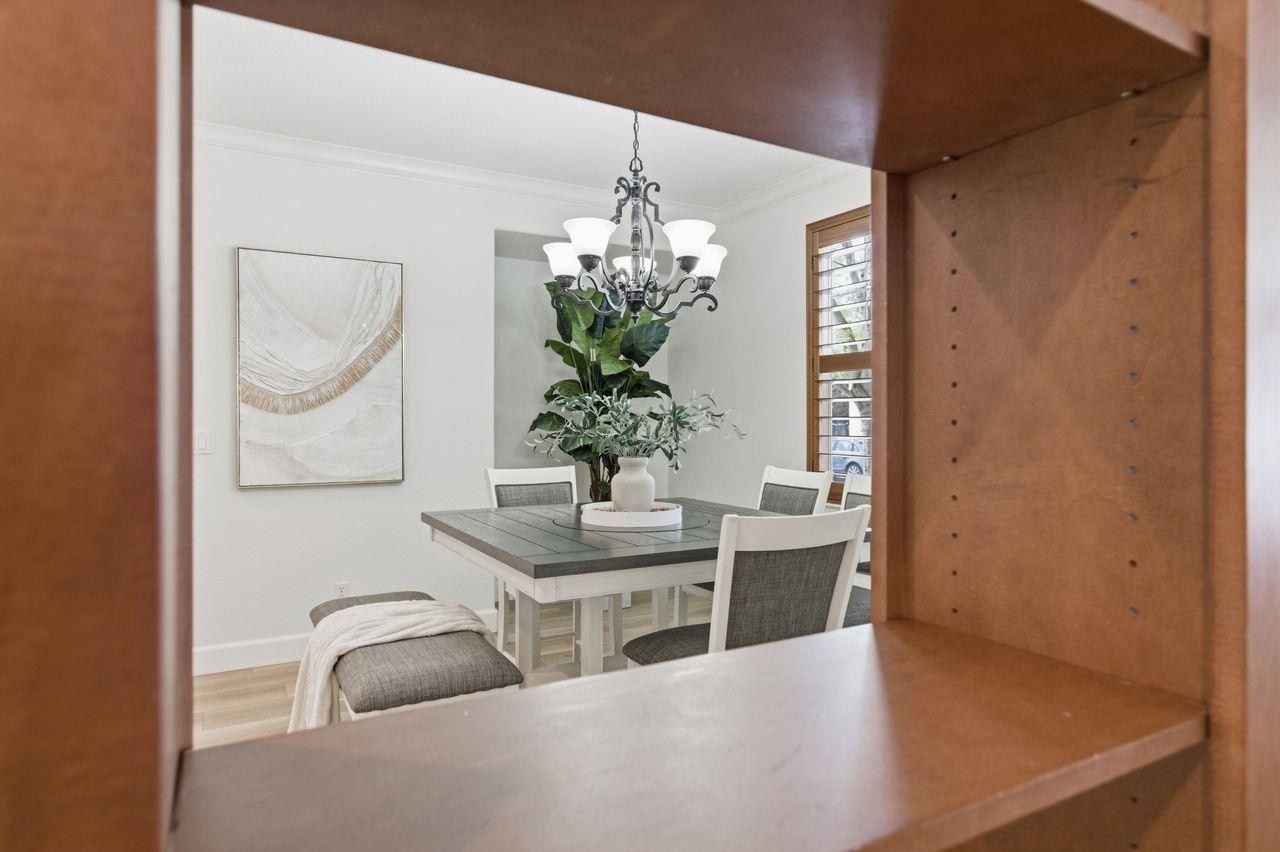 698 West Rico Way Tracy, CA 95391 - Photo 9 of 48 a dining room with furniture and chandelier