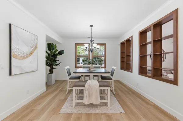 a dining room with furniture and window