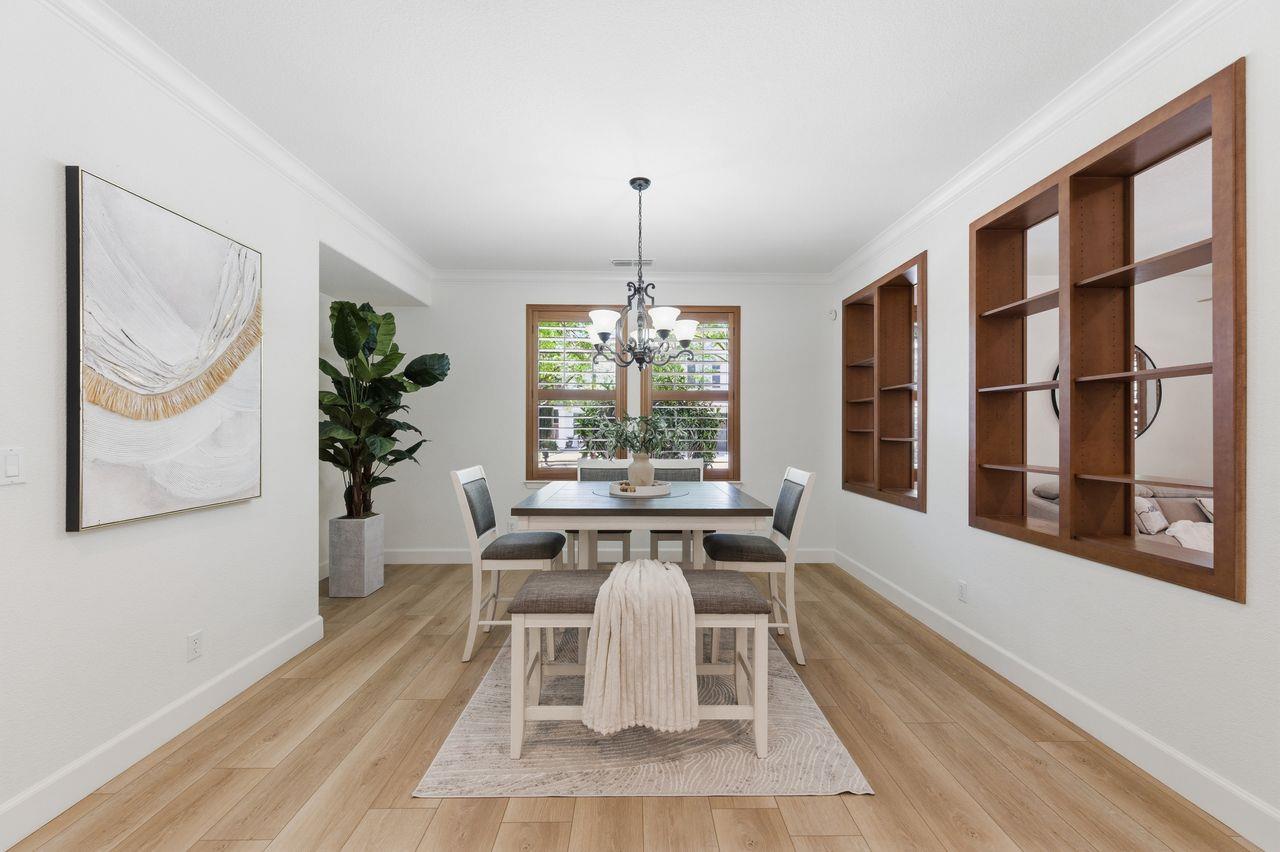 698 West Rico Way Tracy, CA 95391 - Photo 10 of 48 a dining room with furniture and window