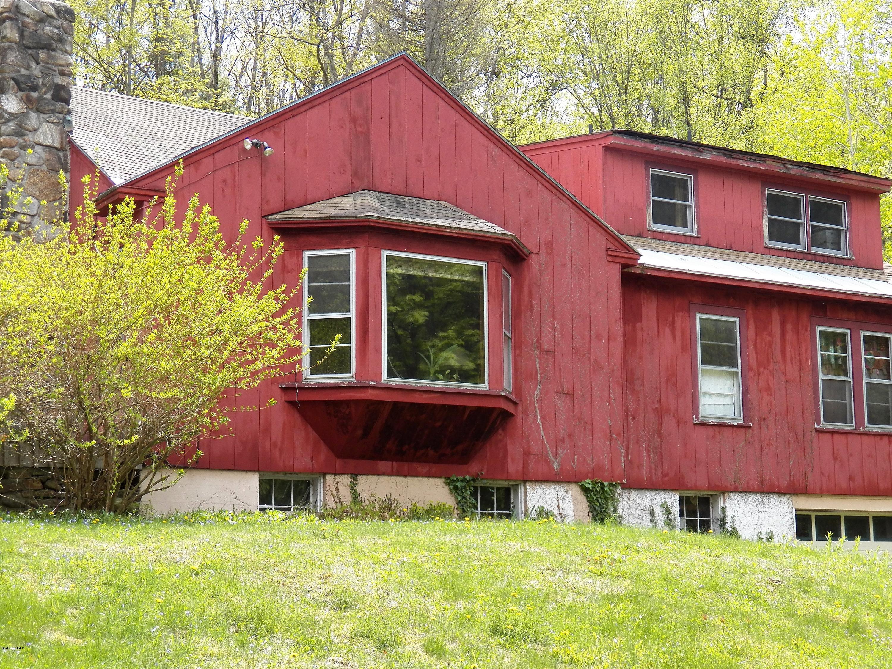 54 Sandisfield Road Monterey, MA 01245 - Photo 2 of 13 a front view of a house with garden