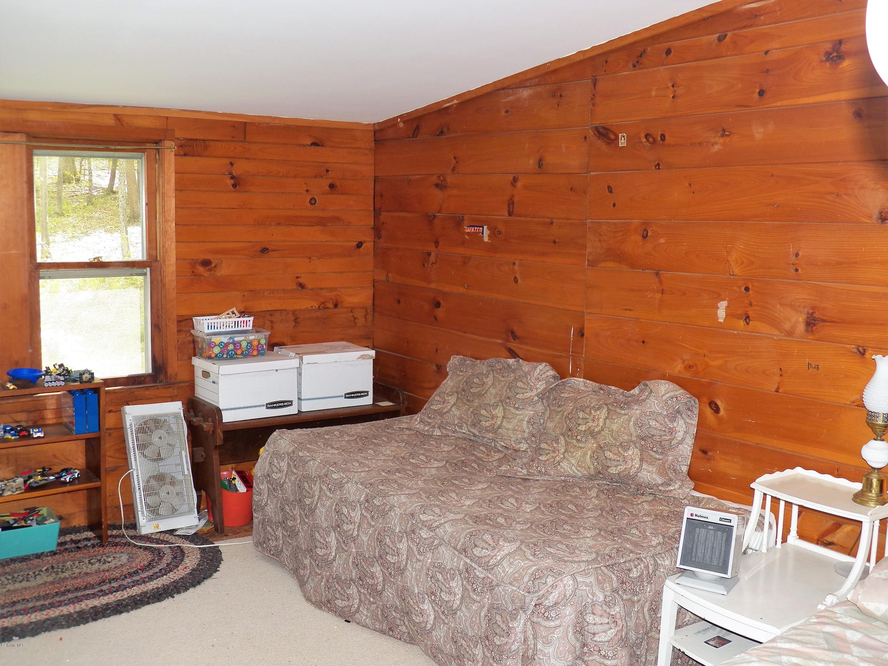 54 Sandisfield Road Monterey, MA 01245 - Photo 13 of 13 a bedroom with a bed and a window