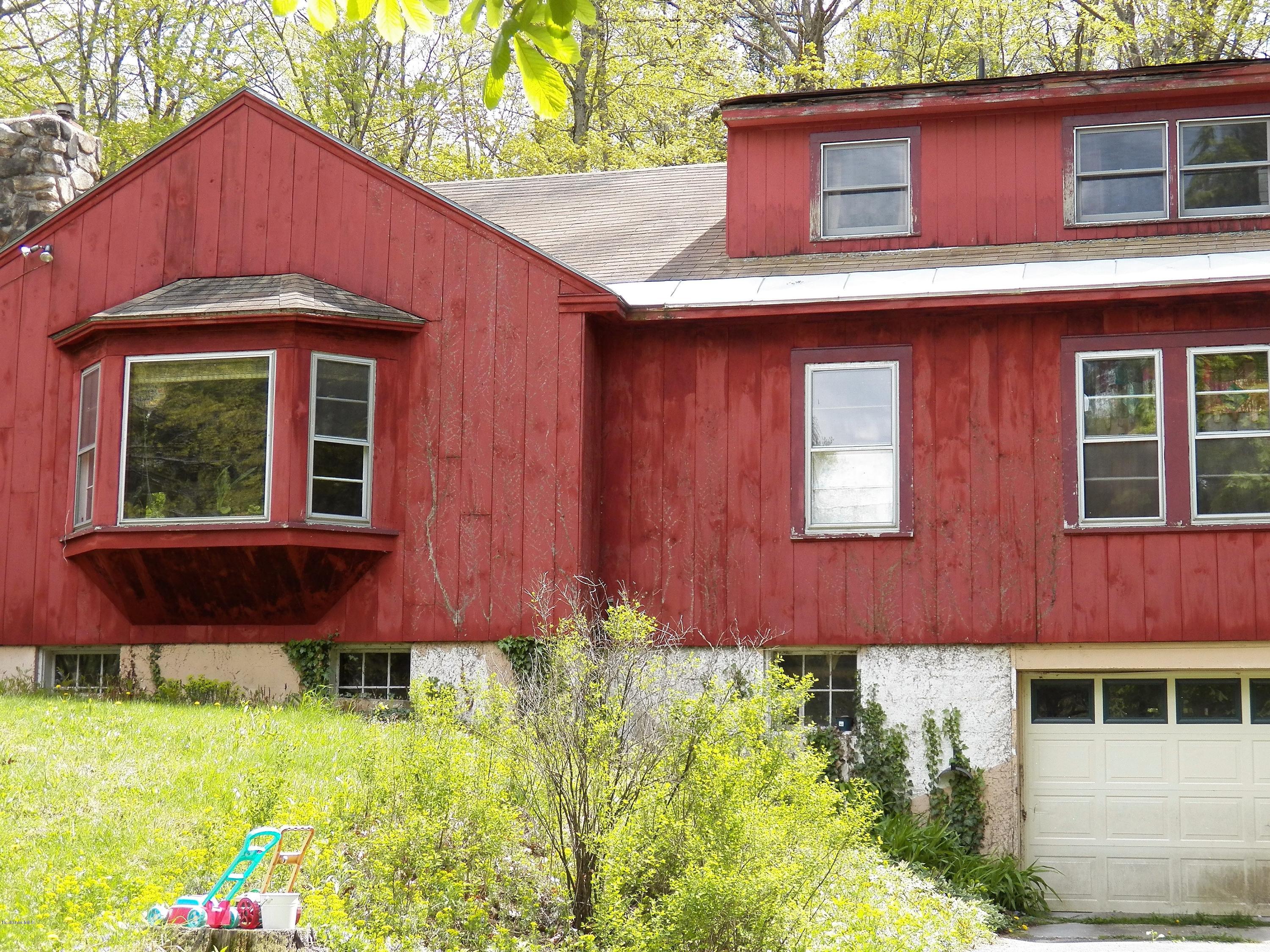 54 Sandisfield Road Monterey, MA 01245 - Photo 3 of 13 a front view of a house with garden