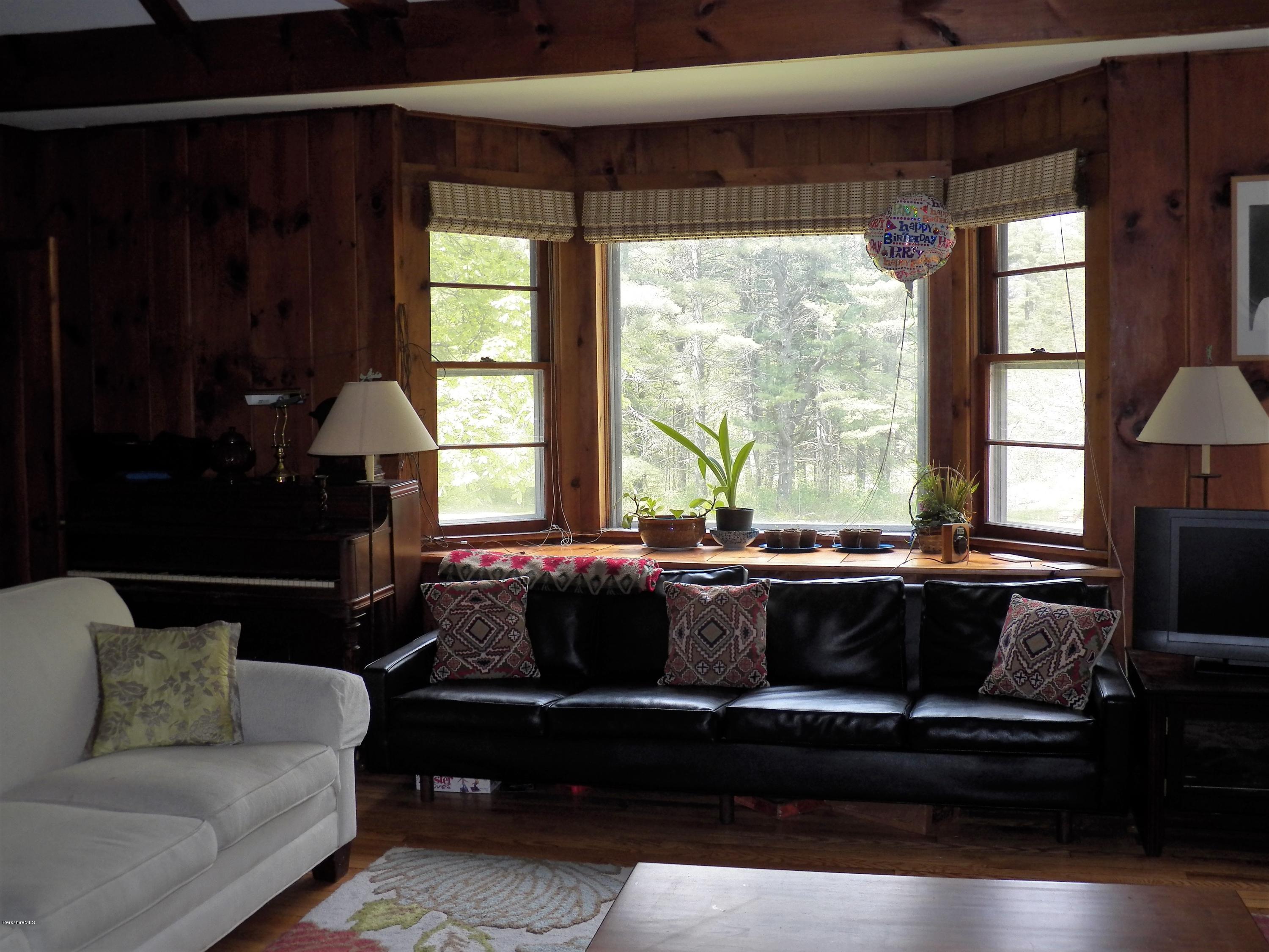 54 Sandisfield Road Monterey, MA 01245 - Photo 5 of 13 a living room with furniture and a window