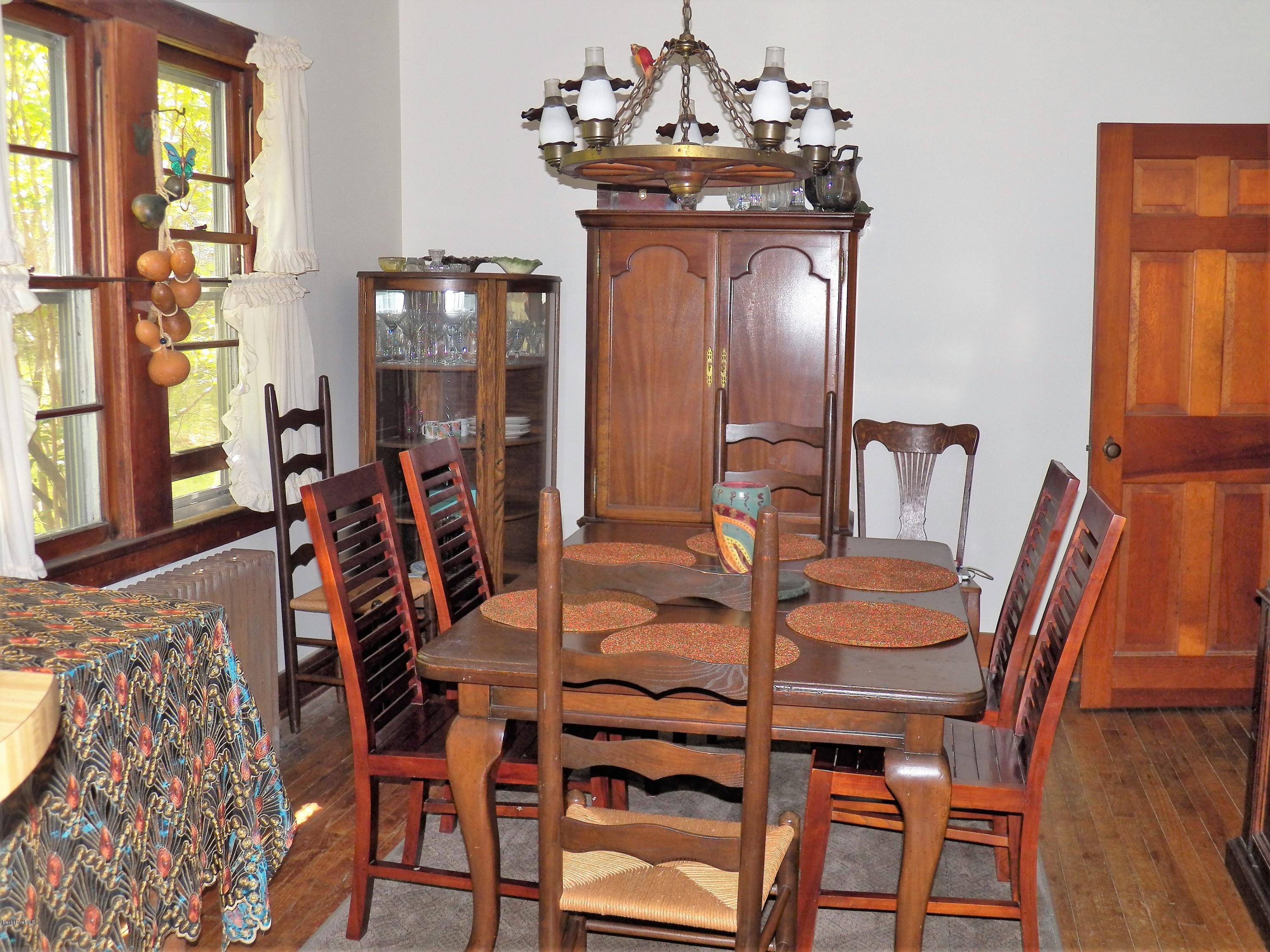 54 Sandisfield Road Monterey, MA 01245 - Photo 7 of 13 a view of a dining room with furniture and window