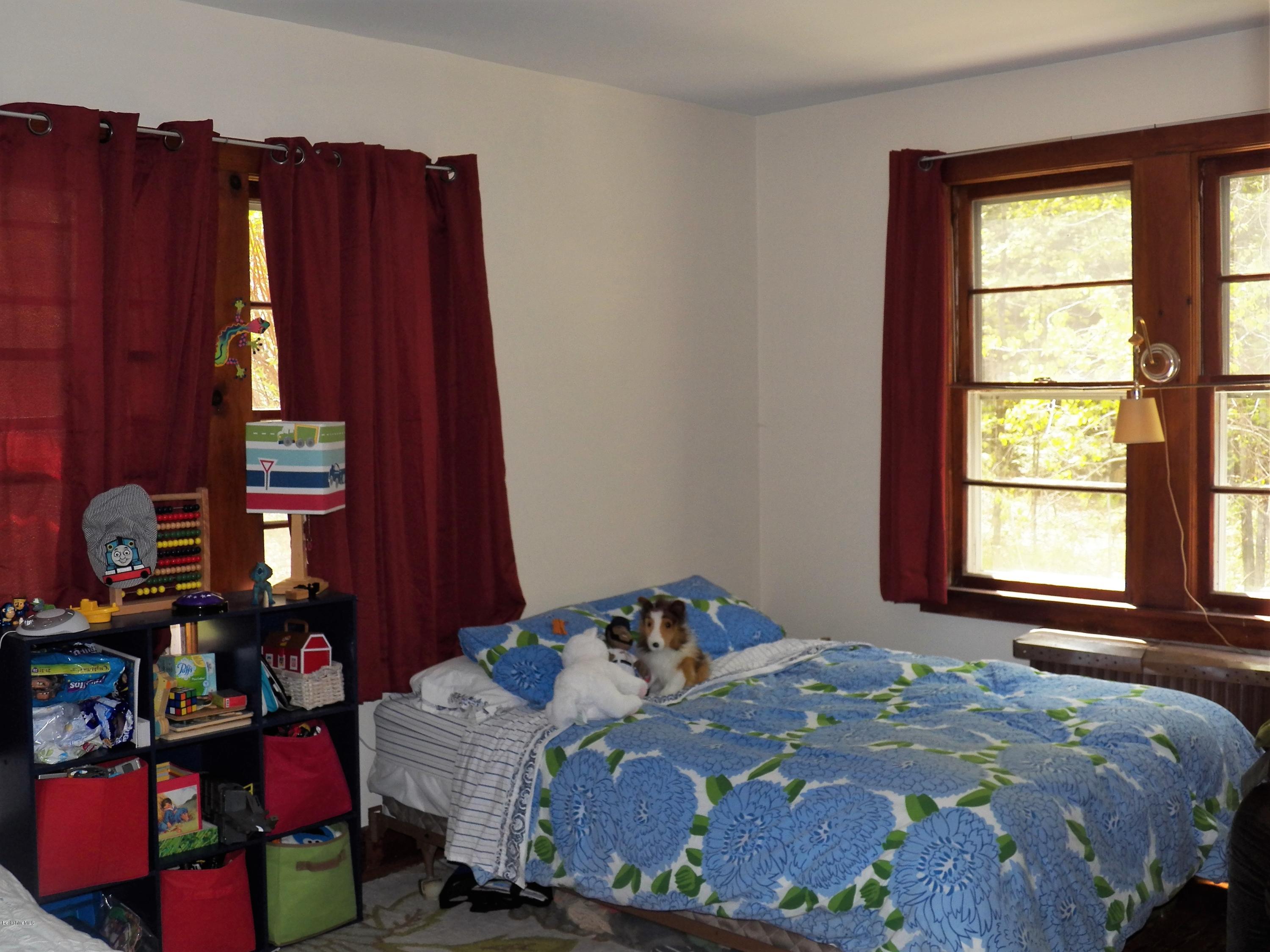 54 Sandisfield Road Monterey, MA 01245 - Photo 10 of 13 a bedroom with a bed and a closet