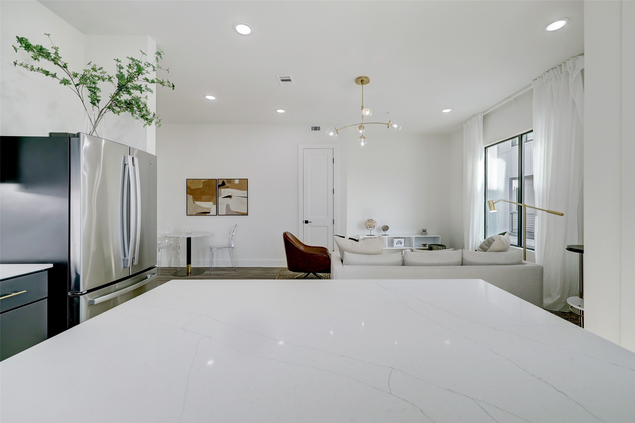 4932 Old Spanish Trail, Unit D301 Houston, TX 77021 - Photo 13 of 29 a large bedroom with a large bed and a chandelier