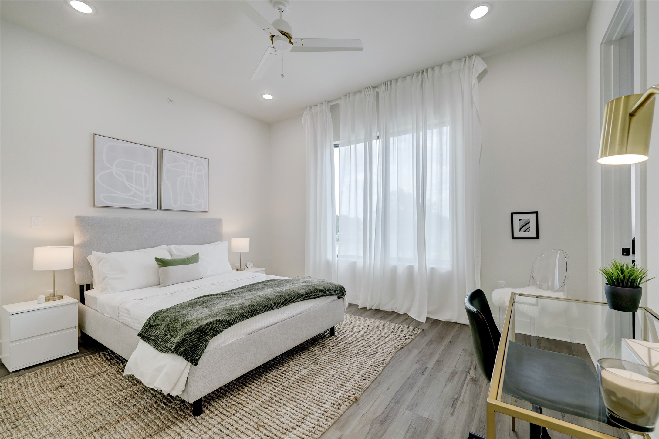 4932 Old Spanish Trail, Unit D301 Houston, TX 77021 - Photo 16 of 29 a bedroom with a bed a chair and a potted plant