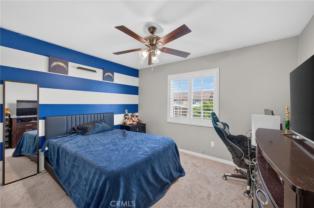 23347 Crystal Way Wildomar, CA 92595 - Photo 76 of 109 a bed room with a bed and a window
