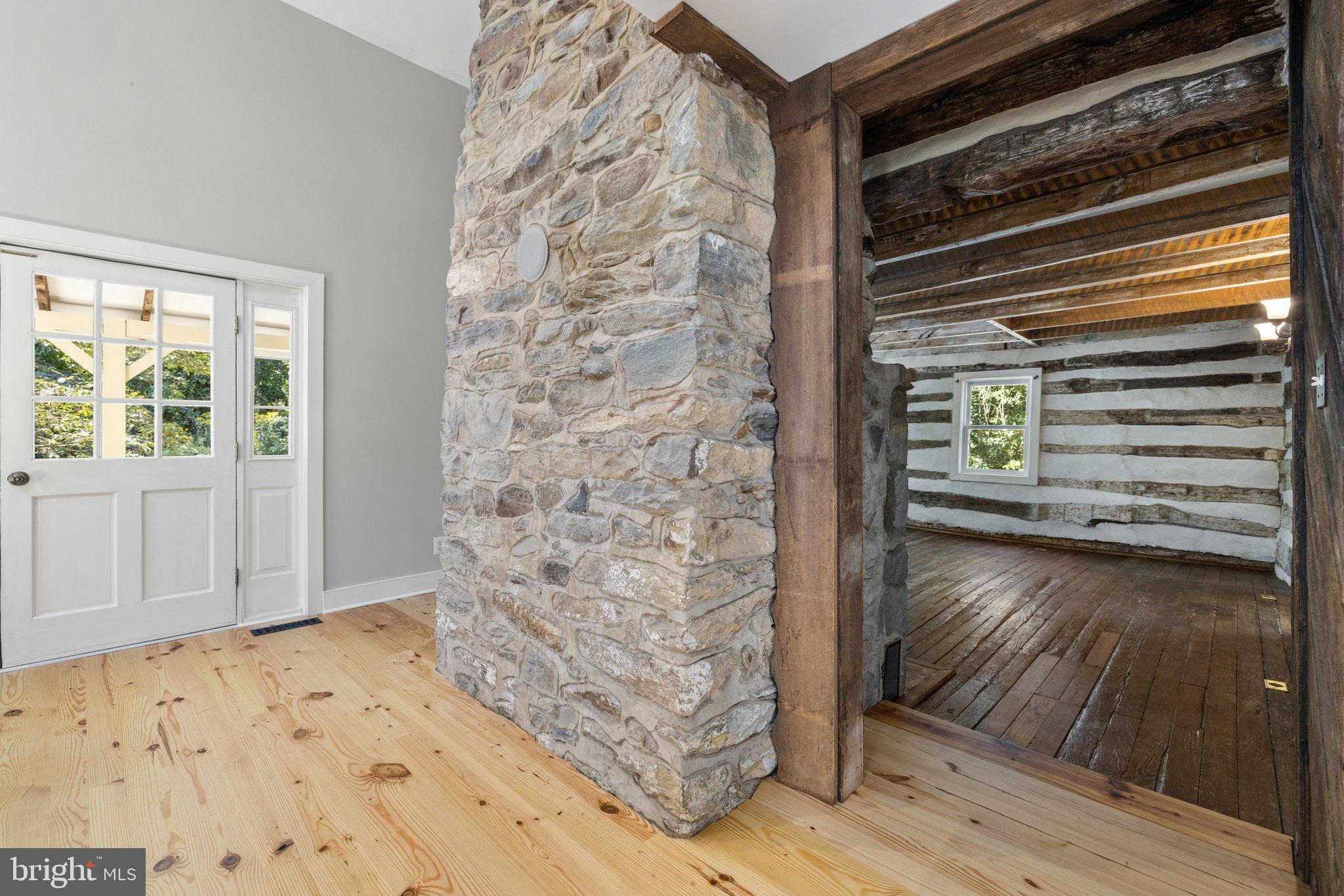 37028 Gaver Mill Road Purcellville, VA 20132 - Photo 14 of 79 Foyer with Beautiful Stone Fireplace Chimney