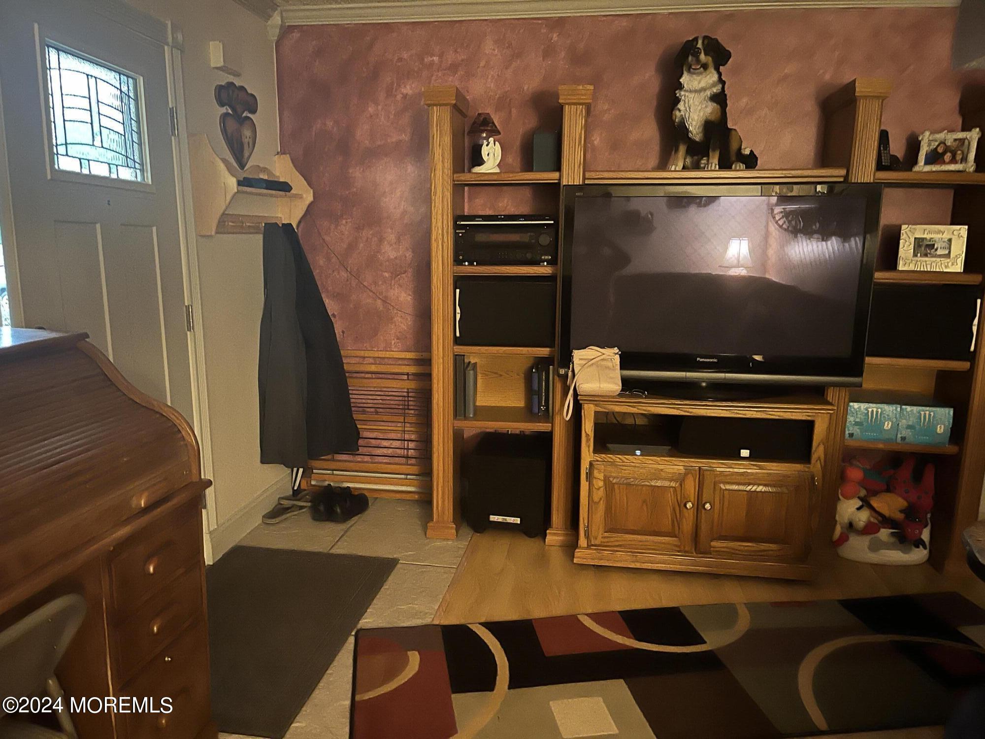 80 Greenwood Loop Road Brick, NJ 08724 - Photo 7 of 37 a room with furniture and a flat screen tv