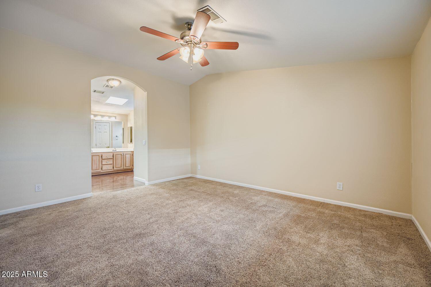 2550 South Ellsworth Road, Unit 277 Mesa, AZ 85209 - Photo 13 of 21 an empty room with windows and fan