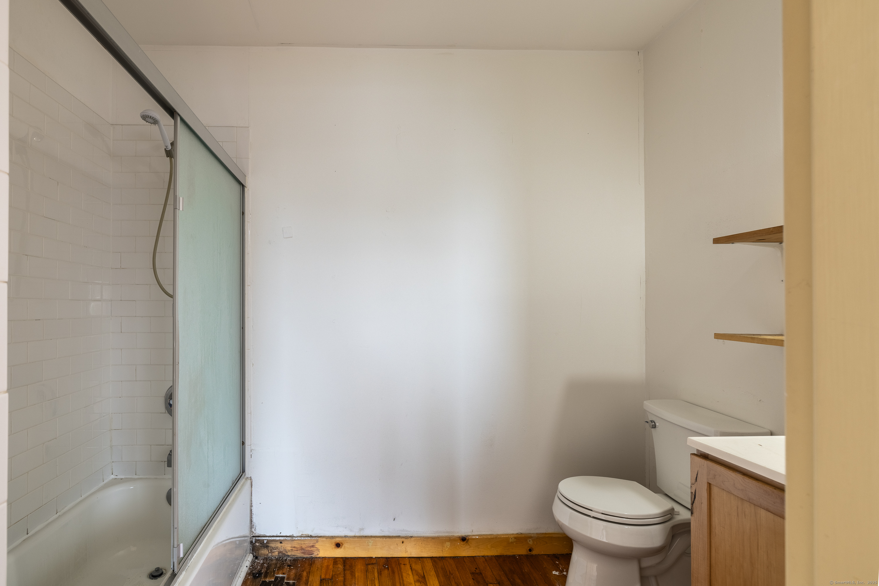 325 Lafayette Street, Unit 8102 Bridgeport, CT 06604 - Photo 12 of 19 a bathroom with a toilet and a shower