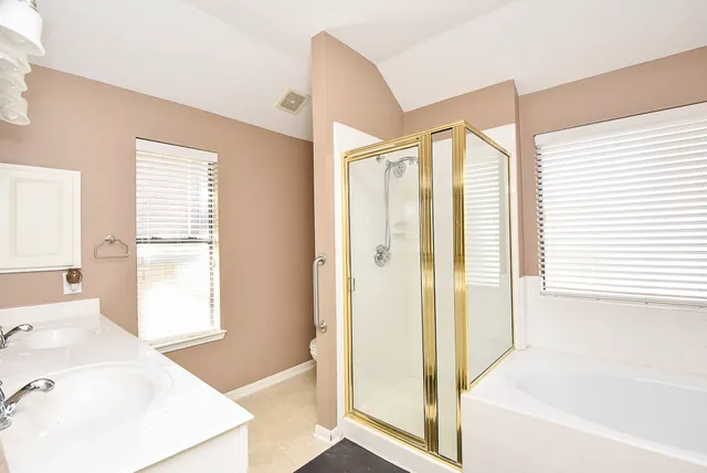 a bathroom with a bathtub and a sink