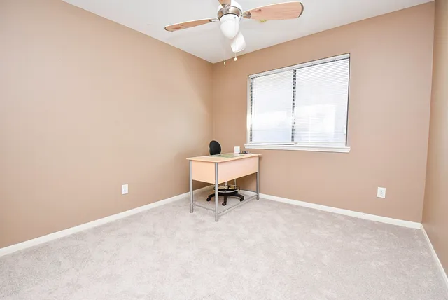 a workspace with furniture and a window