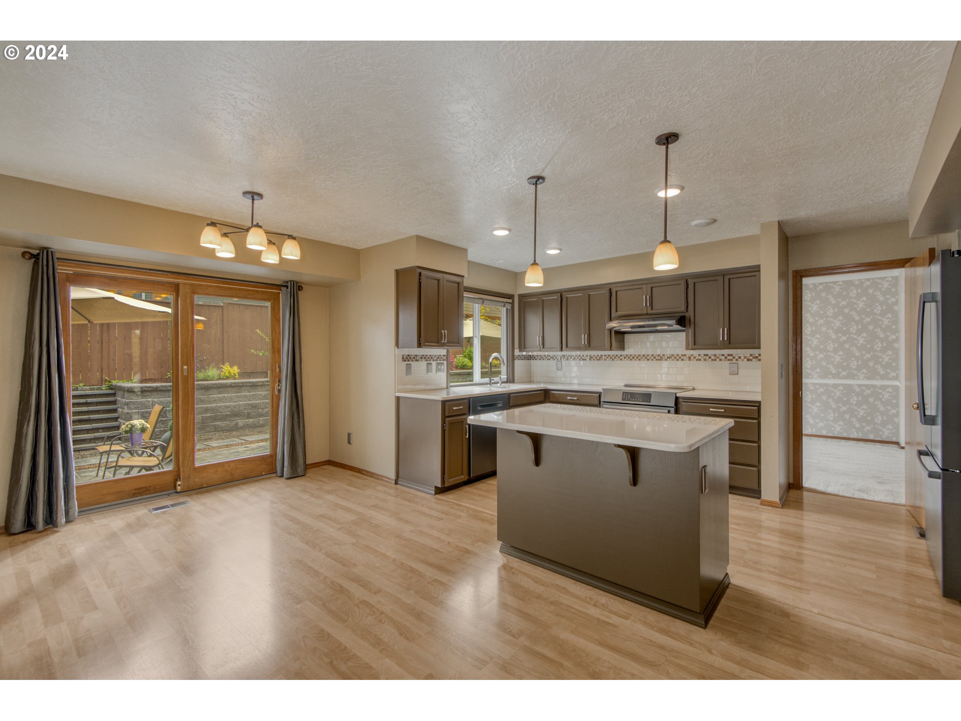 612 Southeast Lovrien Place Gresham, OR 97080 - Photo 11 of 48 a kitchen with stainless steel appliances granite countertop a sink a stove and a refrigerator