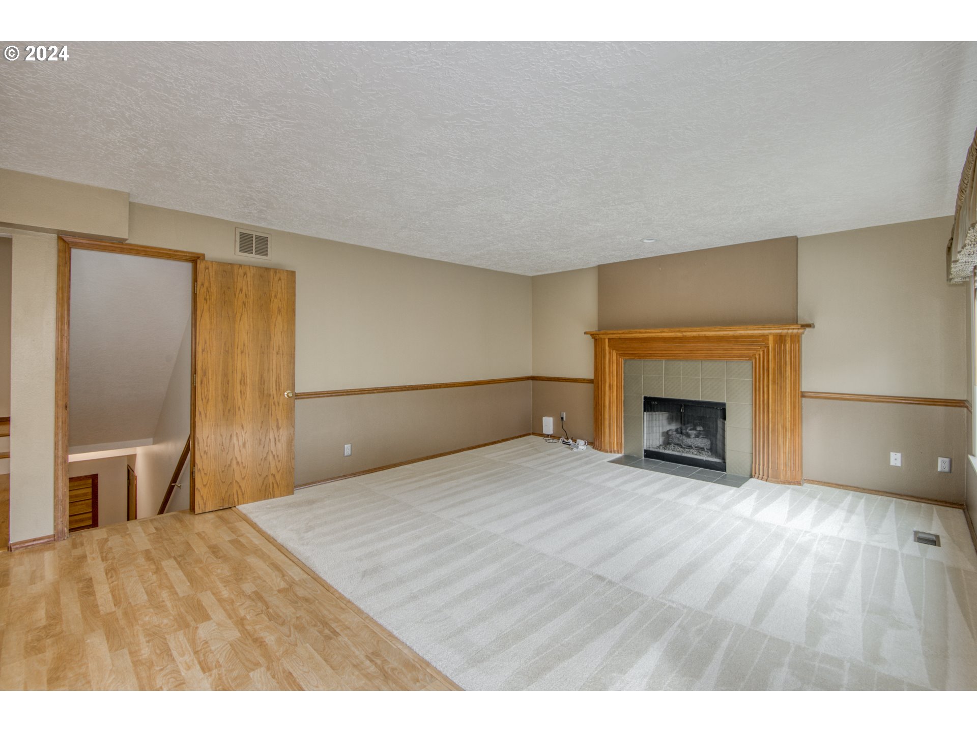 612 Southeast Lovrien Place Gresham, OR 97080 - Photo 14 of 48 a bedroom with a bed and a fireplace