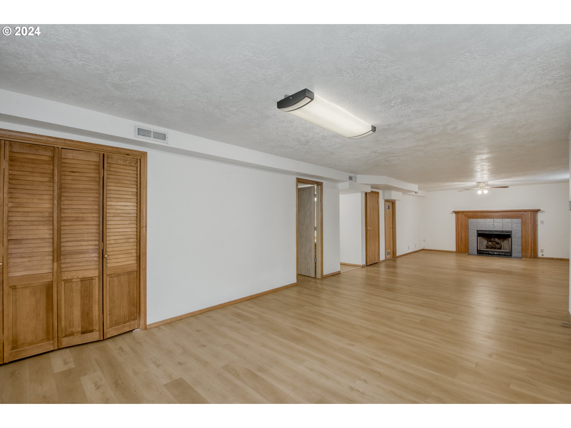 612 Southeast Lovrien Place Gresham, OR 97080 - Photo 29 of 48 a view of an empty room with wooden floor and a window