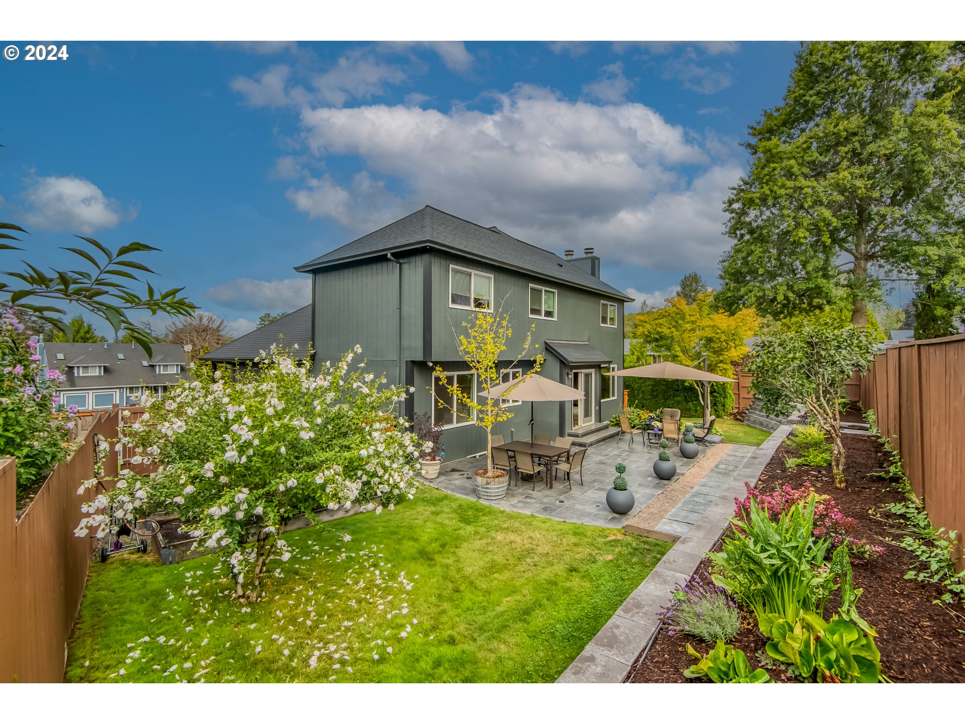 612 Southeast Lovrien Place Gresham, OR 97080 - Photo 44 of 48 a view of a patio with table and chairs and potted plants