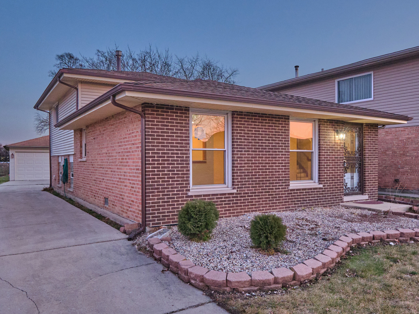 18207 Ravisloe Terrace Country Club Hills, IL 60478 - Photo 24 of 24 a front view of a house with garden