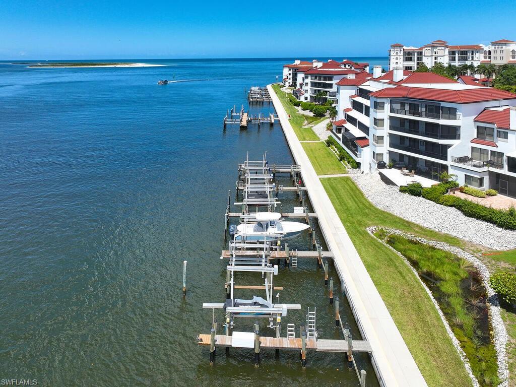 324 La Peninsula Boulevard, Unit 324 Naples, FL 34113 - Photo 1 of 35 a view of a balcony with chairs