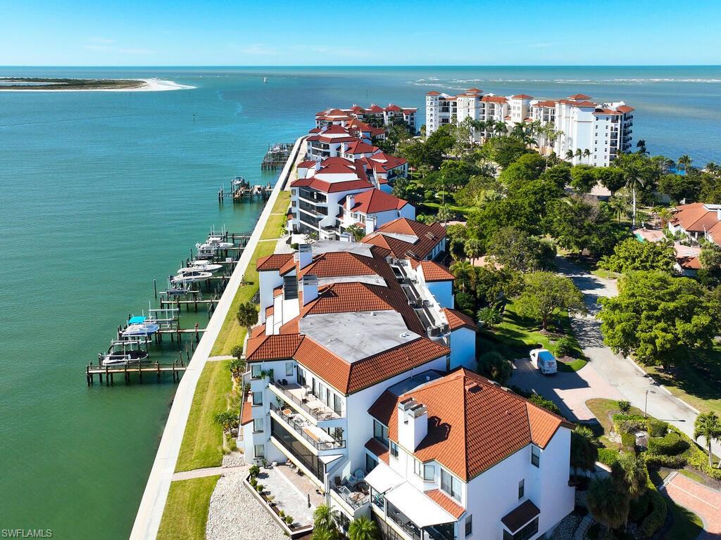 324 La Peninsula Boulevard, Unit 324 Naples, FL 34113 - Photo 24 of 35 a view of a balcony with chairs