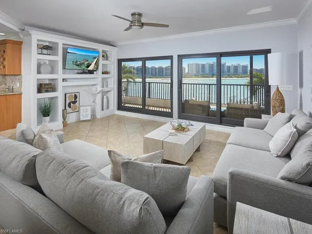 a living room with furniture fireplace and a flat screen tv