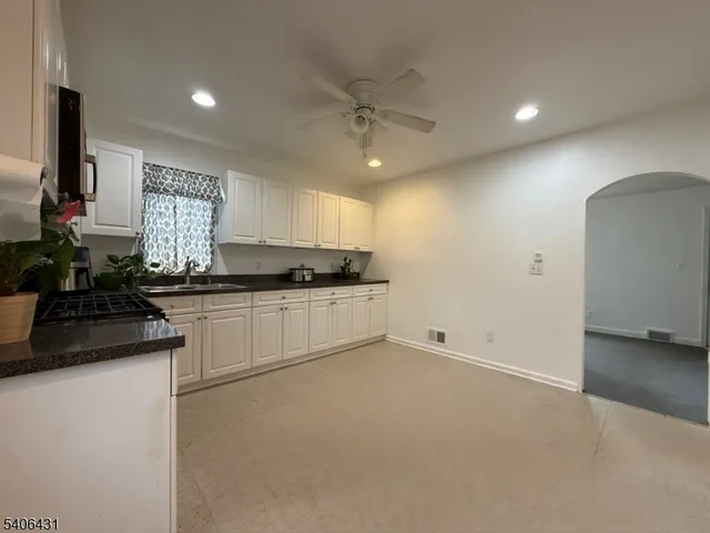 an empty room with a empty space and windows